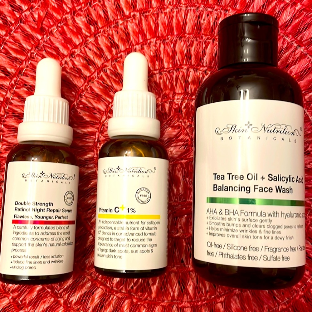 Set of three repair serum, vitamin C and tea tree oil face wash